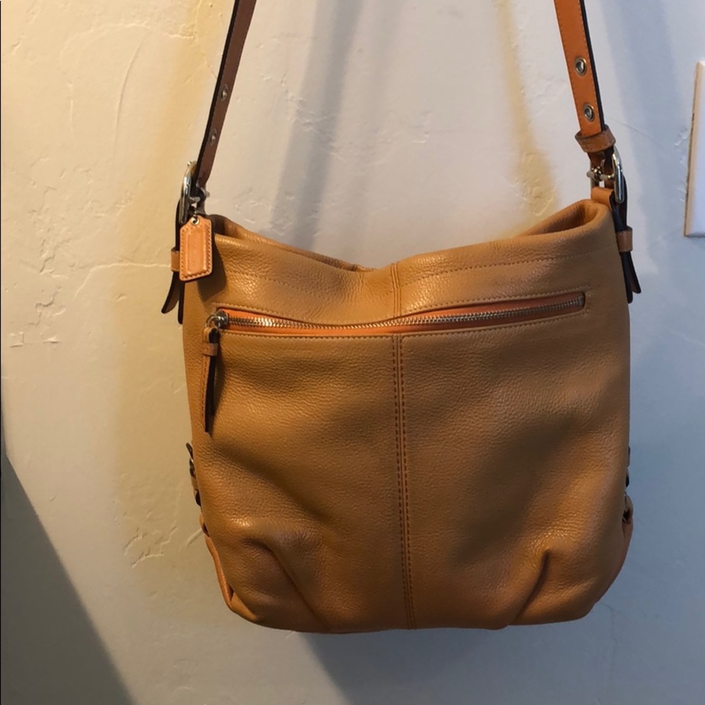 Orange leather Coach crossbody purse